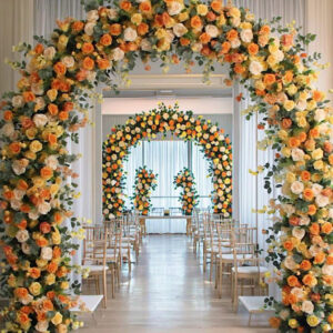 Elegant yellow and orange floral wedding arches, artificial flowers for stage decoration, providing the perfect backdrop for photography.