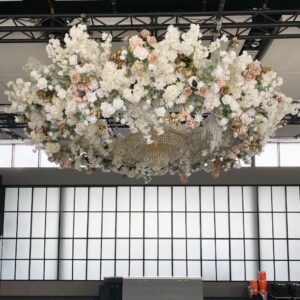 120cm wedding ceiling floral arrangement, pink and white, arranged in a hoop, suspended from a metal chandelier, circular wreath for wedding ceiling decoration.